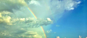 Rainbow shining through clouds