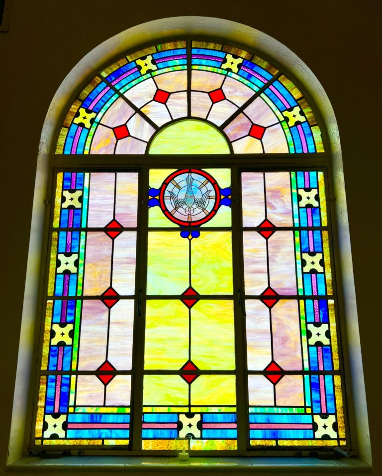 Stained glass image from Chapel with bird